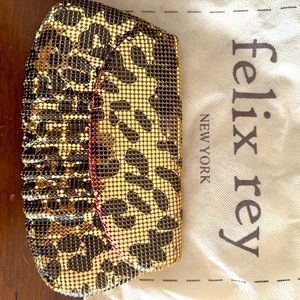 Gold Leopard metal mash clutch New York Felix Rey